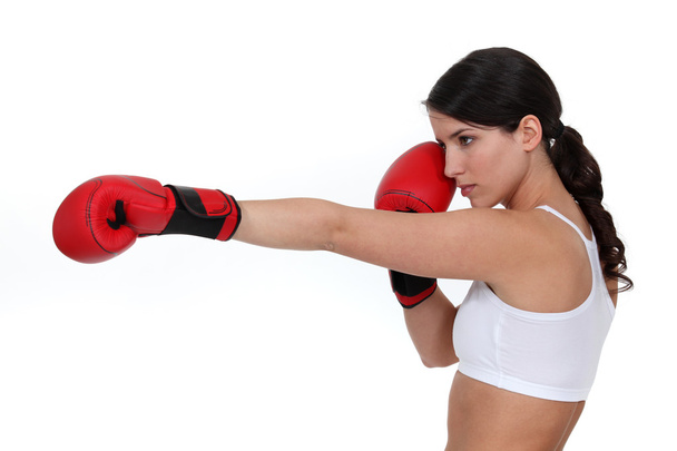 Boxer throwing a punch - Zdjęcie, obraz