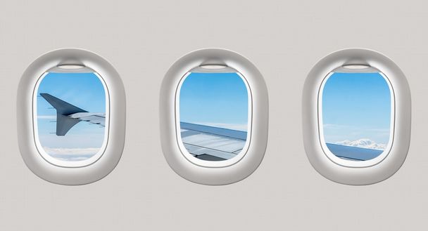 航空機の翼とクル行きの飛行機の窓の外を見てください。 - 写真・画像