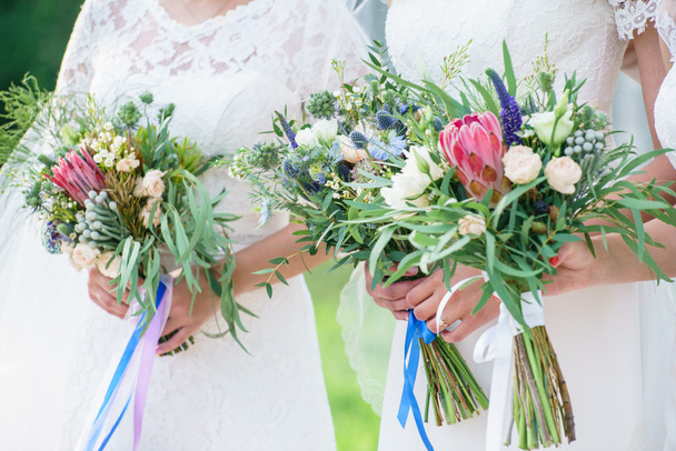 bride and friends holding flowers - Photo, Image