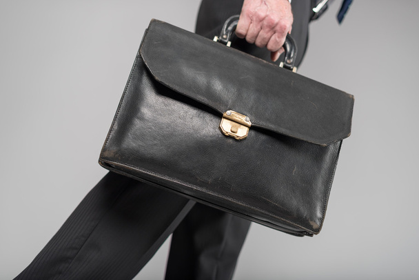 Businessman walking with his briefcase - Fotoğraf, Görsel