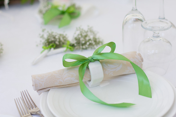 Beautiful elegant table set for wedding or event party. Flower decoration for a wedding. Invitation card for wedding table. - 写真・画像