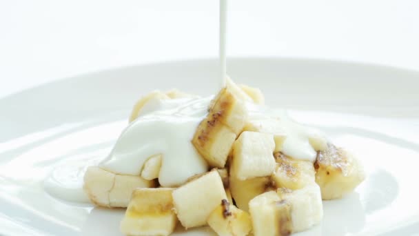 A healthy breakfast -  banana filled with yogurt - Footage, Video
