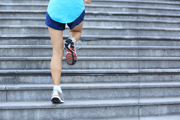 female legs running up on stairs - Foto, Bild