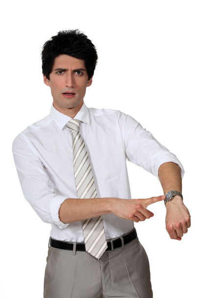 Businessman angrily pointing to his watch - Zdjęcie, obraz