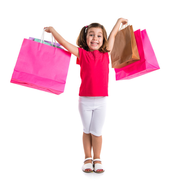 Girl with many shopping bags - Foto, imagen