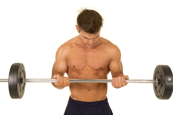 young sporty man with barbell - 写真・画像