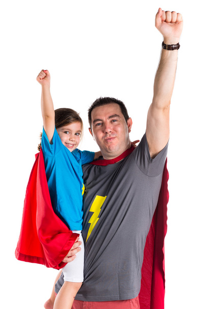 Famille habillée comme un super héros faisant un geste de mouche
 - Photo, image