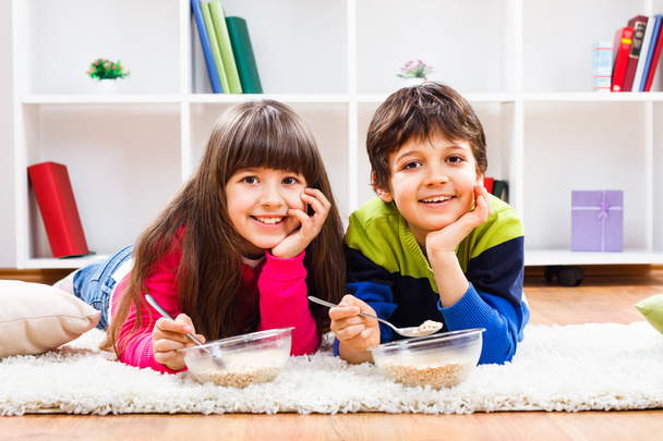 boy and girl eating muesli - Фото, изображение