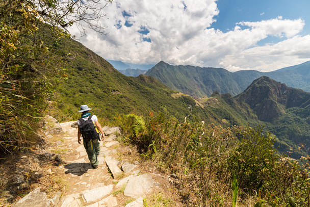 Backpacker exploring Machu Picchu trails, Peru - Photo, Image