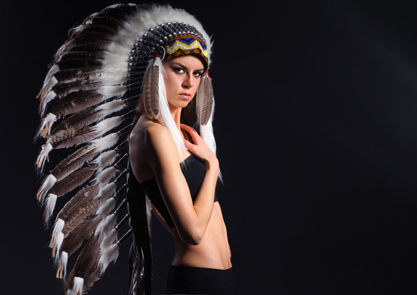 Beautiful woman in native american costume with feathers - Photo, Image