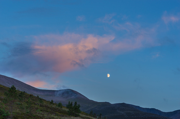 Moon rising over the Cairngorm mountains - Photo, Image