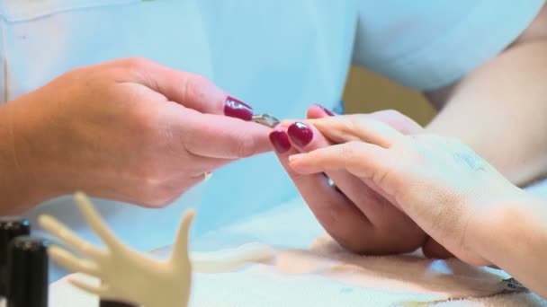 Nail salon. Cuticles care with cuticle pusher - Footage, Video