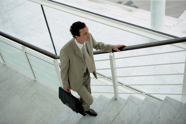 Businessman climbing the stairs - Foto, Bild
