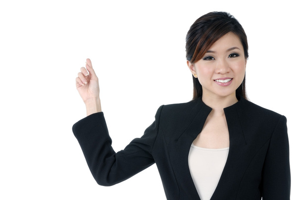 Cute young businesswoman pointing at copyspace - Photo, Image