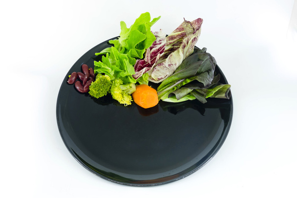 vegetable salad on plate with blank spcae for wording - Fotó, kép