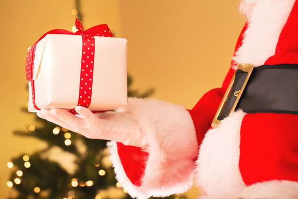 Santa with Christmas present - Фото, изображение