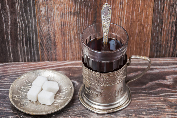 τσάι σε vintage γυαλί με γυαλί-κάτοχος - Φωτογραφία, εικόνα