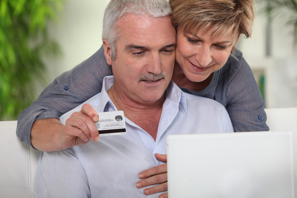 Senior couple shopping on Internet - Фото, изображение