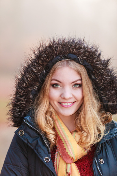 Portrait pretty smiling woman in jacket with hood. - Foto, Imagem