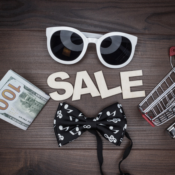 sale concept on the wooden background - Photo, image