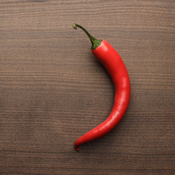red hot chilli pepper on wooden table - Foto, Imagem