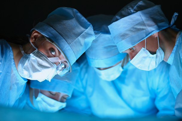 Surgery team in the operating room - Foto, Imagen