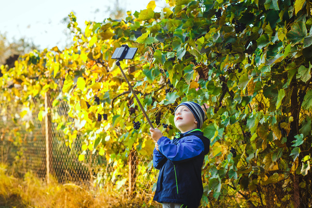 smart happy little boy taking selfie - Фото, изображение