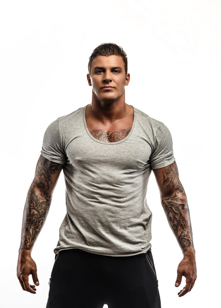 Tattooed man in grey t shirt. - Photo, Image