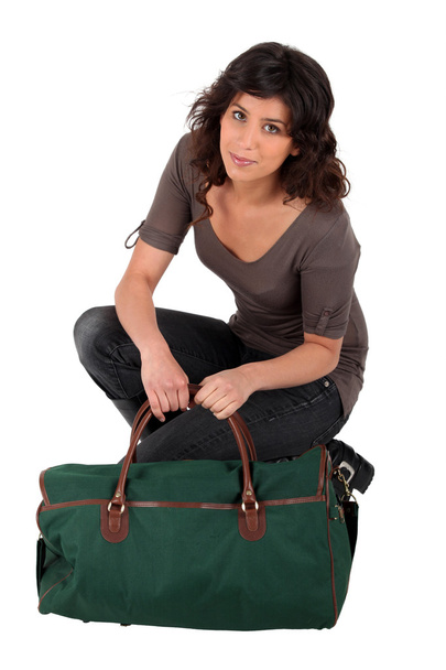 Young woman with suitcase - Valokuva, kuva