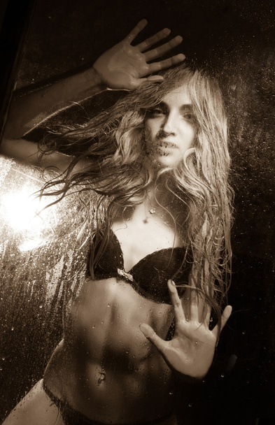Girl in behind wet glass - Zdjęcie, obraz