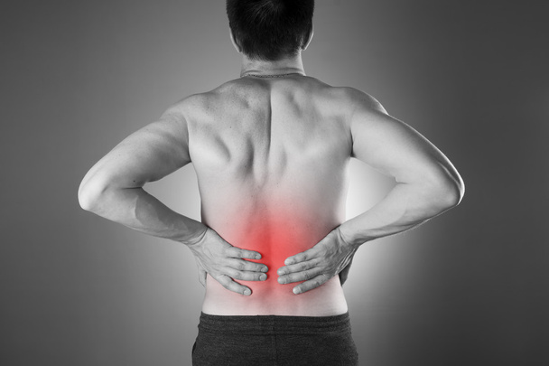 Kidney pain. Man with backache. Pain in the man's body - Foto, afbeelding