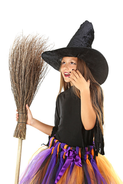 Beautiful girl witch with a broom on a white background - Zdjęcie, obraz