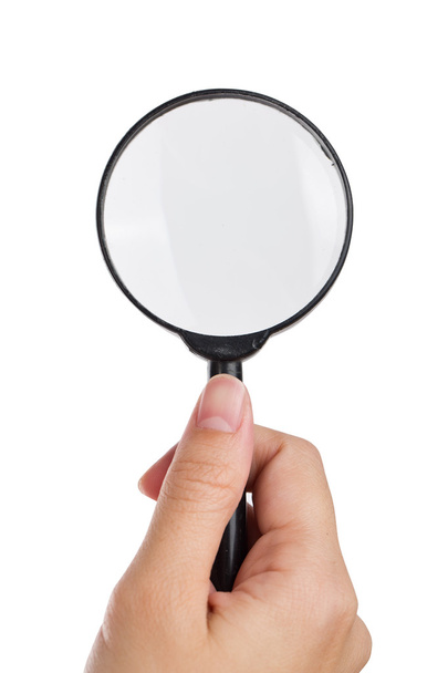 Hand holding magnifier isolated white background. - Photo, Image