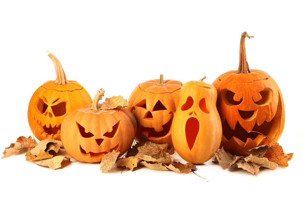 Halloween pumpkins with dry leaves - Photo, image
