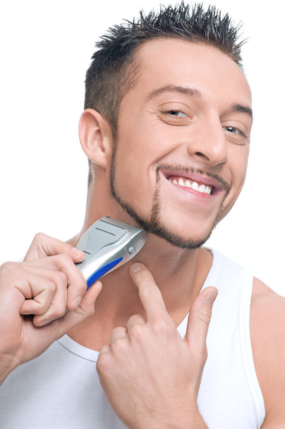 Young handsome man shaving - Fotoğraf, Görsel
