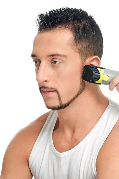 Cutting hairs of attractive man - Фото, зображення