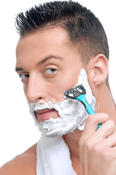 Portrait of man that shaving with foam - Foto, afbeelding