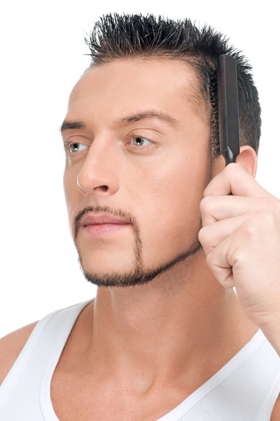Man with perfect hair using comb brush - Фото, изображение