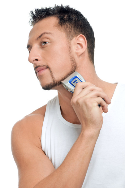 Young handsome man shaving - Фото, зображення
