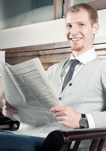 Sure young business man with newspaper - Fotoğraf, Görsel