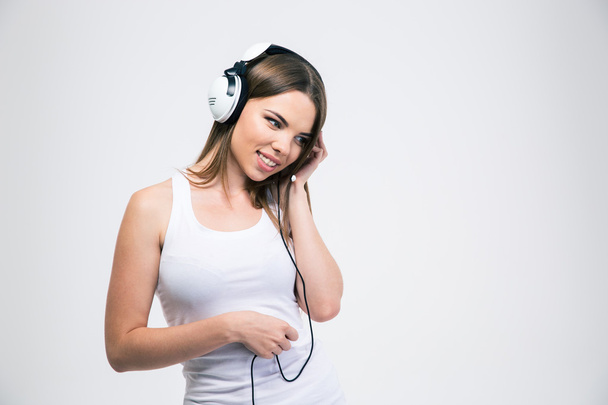 Happy girl listening the music in headphones - Zdjęcie, obraz