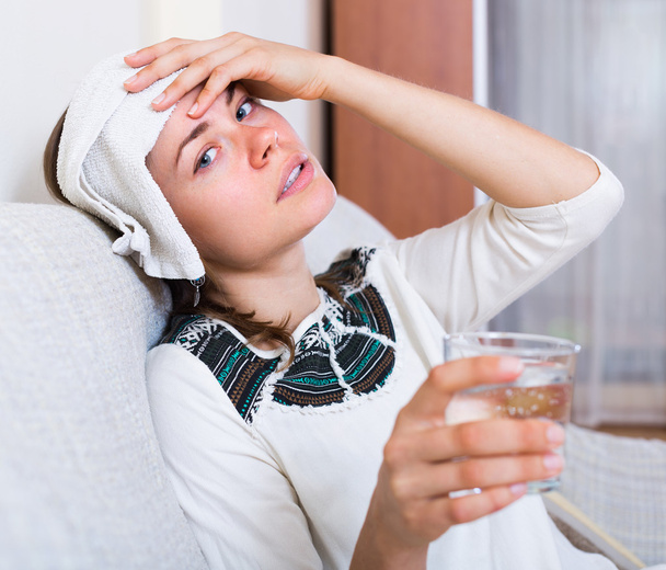 Adult girl having heavy migrain - Foto, afbeelding