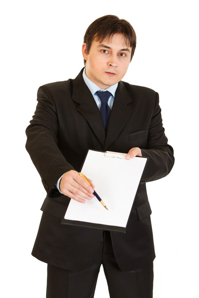Serious modern businessman with documents and pen for your signing - 写真・画像