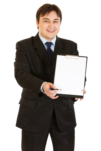 Smiling modern businessman with documents and pen for signing - Фото, изображение