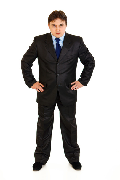 Full length portrait of strict businessman with hands on hips attentively l - Foto, Imagen