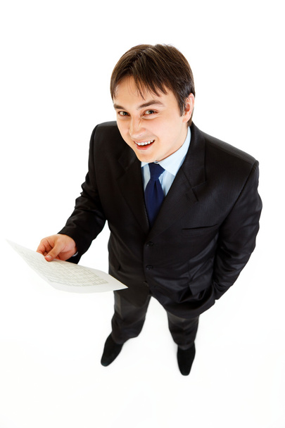Smiling modern businessman holding financial document in hand - Zdjęcie, obraz