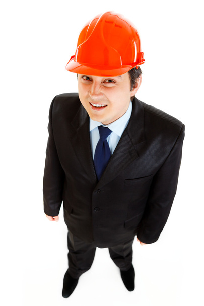 Smiling businessman with helme on head - Photo, Image