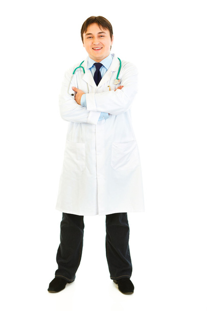 Full length portrait of smiling doctor with crossed arms on chest - Foto, Imagem