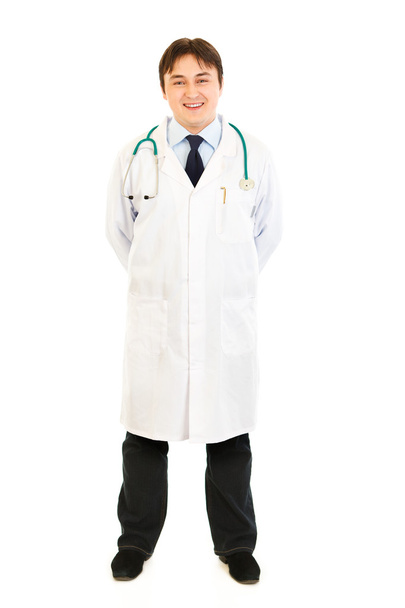 Smiling young medical doctor in uniform with stethoscope - Foto, Bild