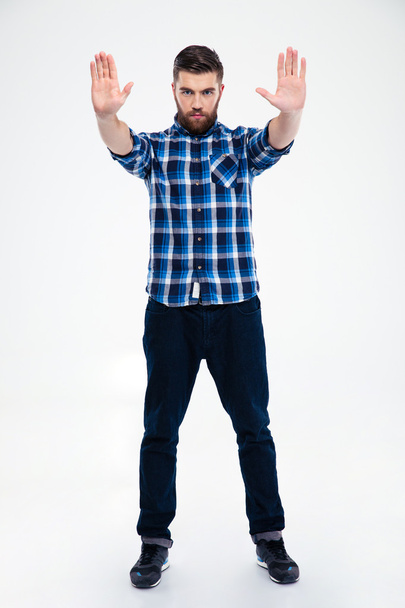 Casual man showing stop gesture with palms - 写真・画像